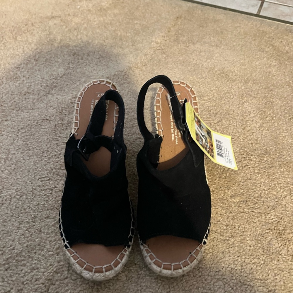 Tom’s black suede
